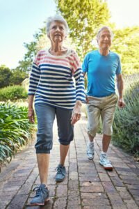 Why Metabolism Slows After 60: Simple Tips That Help Older adult walking outdoors in bright daylight